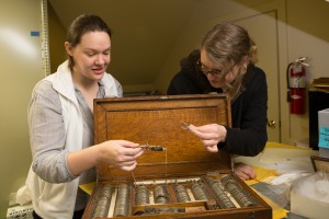 History Graduate Students working on this year's SWAT project at the Milton Historic Society. Shown in photos: Hillary Neeben (black sweatshirt, glasses), Betsy Keene (white vest), and Allison Schell (MHS Director in blue dress).